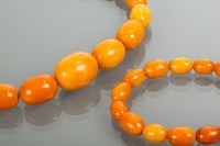 Lot 2062 - BUTTERSCOTCH AMBER BEAD NECKLACE AND BRACELET...