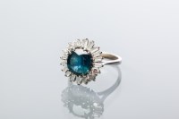 Lot 2063 - SAPPHIRE AND DIAMOND CLUSTER RING with a...