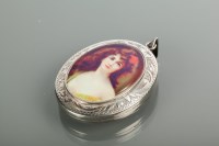 Lot 2142 - SILVER AND ENAMEL PORTRAIT LOCKET of oval form,...