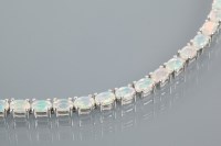 Lot 2150A - SILVER OPAL BRACELET set with oval cut opals,...