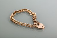 Lot 2154 - NINE CARAT GOLD CURB LINK BRACELET the padlock...