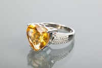 Lot 2156 - SILVER HEART MOTIF CITRINE DRESS RING set with...
