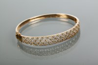 Lot 2169 - NINE CARAT GOLD AND DIAMOND SET BANGLE the...