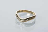 Lot 2184 - DIAMOND SET WEDDING BAND channel set with...