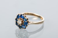 Lot 2198A - SAPPHIRE AND DIAMOND CLUSTER RING the central...