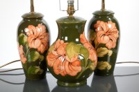 Lot 131 - THREE MOORCROFT TABLE LAMPS the baluster...