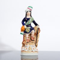 Lot 233 - VICTORIAN STAFFORDSHIRE FIGURE OF A HIGHLANDER...