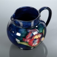 Lot 243 - MOORCROFT OVIFORM JUG painted with flowers in...