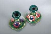 Lot 244 - PAIR OF MOORCROFT CANDLESTICKS painted with...