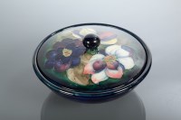 Lot 245 - MOORCROFT CIRCULAR JAR AND COVER painted with...