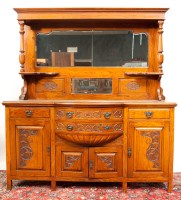 Lot 352 - LATE VICTORIAN CARVED OAK BOWFRONT SIDEBOARD...