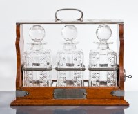 Lot 380 - VICTORIAN OAK TANTALUS the three cut crystal...