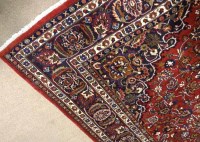 Lot 424 - MODERN IRANIAN CARPET with red ground and...