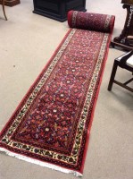 Lot 429 - MODERN IRANIAN RUNNER with red ground, 964cm...