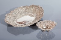 Lot 22 - TWO SILVER BASKETS maker William Comyns & Sons,...