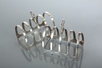 Lot 41 - TWO OF EDWARDIAN SILVER TOAST RACKS maker...