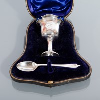 Lot 47 - SILVER EGG CUP AND SPOON maker William Hutton...