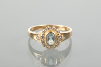 Lot 1122 - AQUAMARINE AND DIAMOND CLUSTER RING set with a...