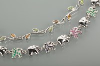 Lot 1123 - TWO SILVER GEM SET BRACELETS one with elephant...