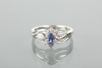 Lot 1130 - TANZANITE AND DIAMOND DRESS RING with a...