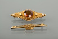 Lot 1145 - TWO GOLD BAR BROOCHES comprising a Victorian...