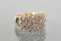 Lot 1157 - DIAMOND CLUSTER RING set with five rows of...