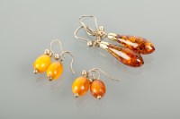Lot 1158 - THREE PAIRS OF TWENTIETH CENTURY AMBER...