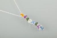 Lot 1166 - UNUSUAL MULTI GEM AND DIAMOND SET PENDANT ON...