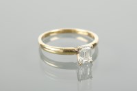 Lot 1175 - DIAMOND SOLITAIRE RING the emerald cut diamond...