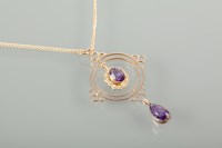 Lot 1182 - EDWARDIAN AMETHYST SET PENDANT with a central...