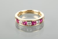 Lot 1185 - RUBY AND DIAMOND HALF ETERNITY RING set with...