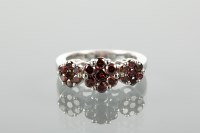 Lot 1193 - RED DIAMOND CLUSTER RING set with three...