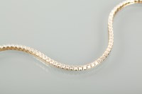 Lot 1205 - EIGHTEEN CARAT GOLD WHITE GEM SET LINE...