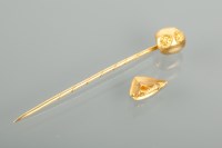 Lot 1223 - GOLD NUGGET TOPPED PIN with embossed marks,...