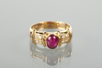 Lot 1231 - RUBY AND DIAMOND DRESS RING the central oval...