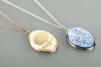 Lot 1257 - TWO ENAMELLED LOCKETS BY MICHAELA FREY one...