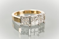 Lot 1262 - DIAMOND CLUSTER RING formed by three sections...