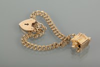 Lot 1293 - NINE CARAT GOLD BRACELET WITH CHARM formed by...