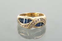 Lot 1294 - SAPPHIRE AND DIAMOND RING with channel set...