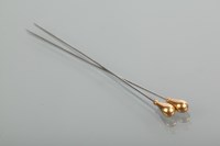Lot 1364 - TWO FOURTEEN CARAT GOLD MOUNTED HAT PINS the...