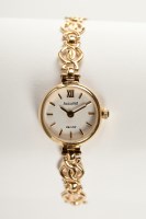 Lot 1079 - LADY'S NINE CARAT GOLD ACCURIST WRIST WATCH...