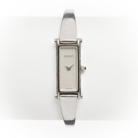 Lot 1570 - LADY'S GUCCI STEEL WATCH the rectangular dial...