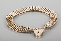 Lot 1736 - NINE CARAT GOLD BRACELET with textured links...