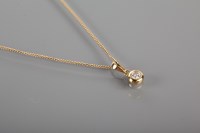 Lot 1739 - DIAMOND SOLITAIRE PENDANT the brilliant cut...