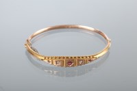Lot 1756 - VICTORIAN RUBY AND DIAMOND BANGLE set with...