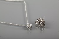 Lot 1758 - DIAMOND PENDANT AND EARRINGS SET of rounded...