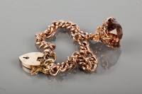 Lot 1763 - NINE CARAT GOLD CURB LINK BRACELET with a...