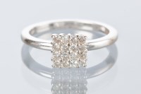 Lot 1772 - DIAMOND CLUSTER RING the square bezel set with...