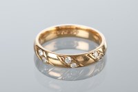 Lot 1775 - DIAMOND SET WEDDING BAND set with three groups...