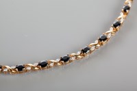 Lot 1778 - SAPPHIRE AND DIAMOND SET BRACELET with oval...
